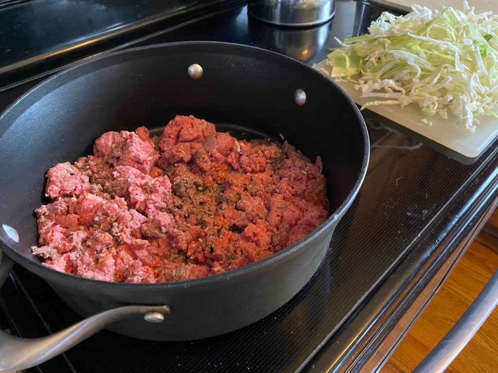 cooking meat and cabbage