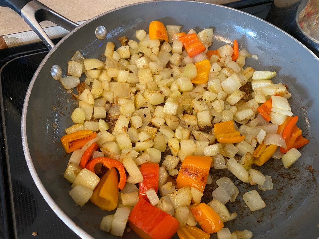 cooking potatoes and peppers